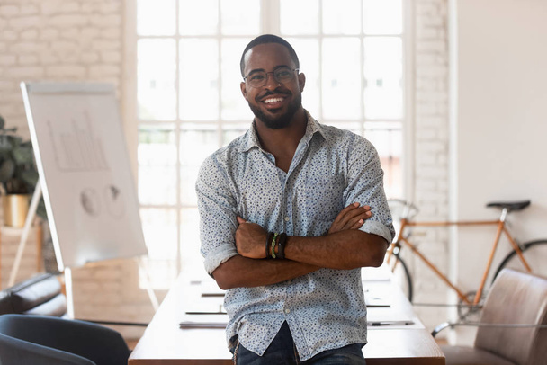 Smiling confident african american young businessman portrait. - Fotó, kép