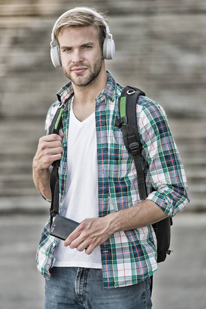 Listen music. Modern and digital youth. trendy man. College student earphones smartphone. Online education. Audio book concept. Educational technology. student e learning. school life - Fotoğraf, Görsel