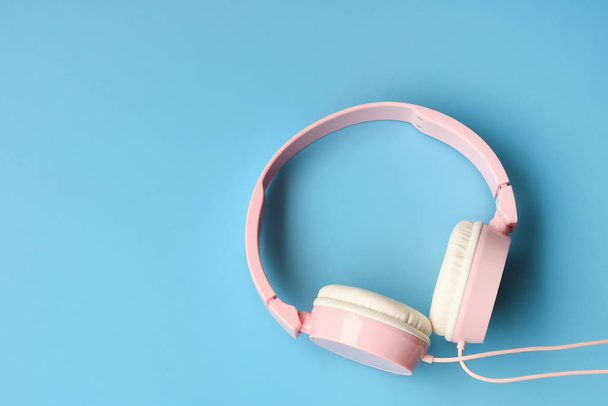 close up of headphones on blue background - Foto, Imagem