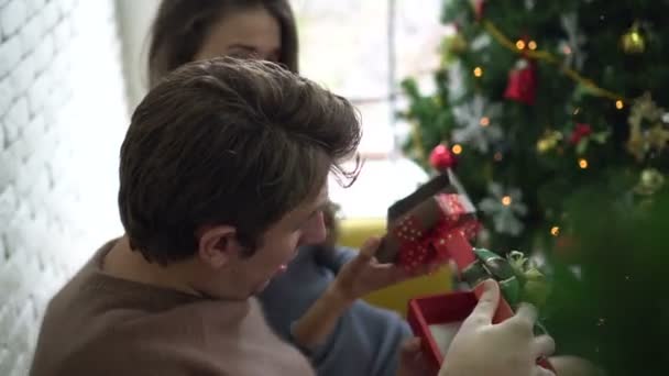 Couple exchage christmas gift care and happy relation celebrating holiday - Footage, Video