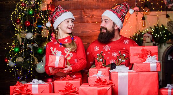 Family Christmas traditions. Happy family celebrate new year and Christmas. Father and little daughter child preparing Christmas presents for the family. Christmas is a family holiday - Фото, изображение
