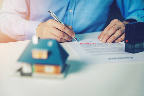 man sign approved family house mortgage contract - 写真・画像