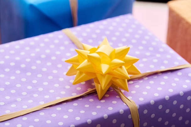 selective focus of present with yellow bow  - Photo, Image