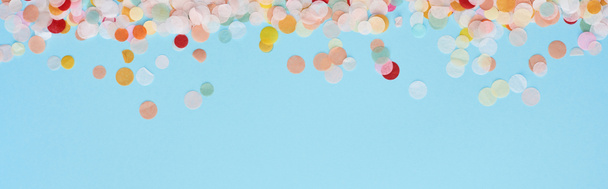 panoramic shot of colorful confetti on blue  - Photo, Image