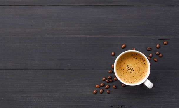 hot coffee and bean on wooden background. top view - Photo, Image