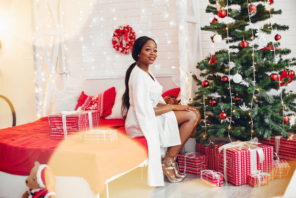 Elegant black girl in the Christmas decorations - Photo, image