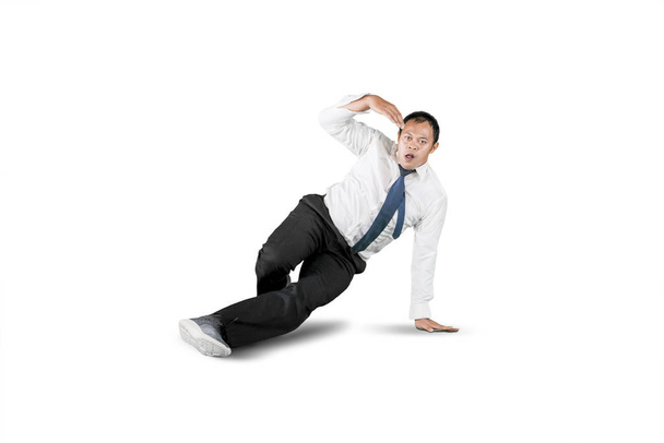 Businessman with break dancing move isolated over white - Fotoğraf, Görsel