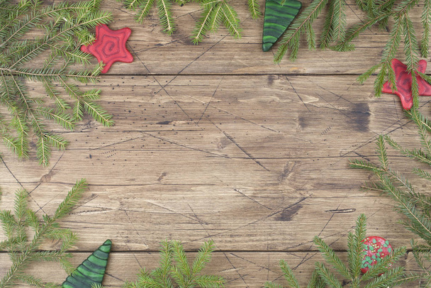 Christmas background. green lollipops shaped christmas tree and red lollipops shaped star with tree branches - Фото, зображення