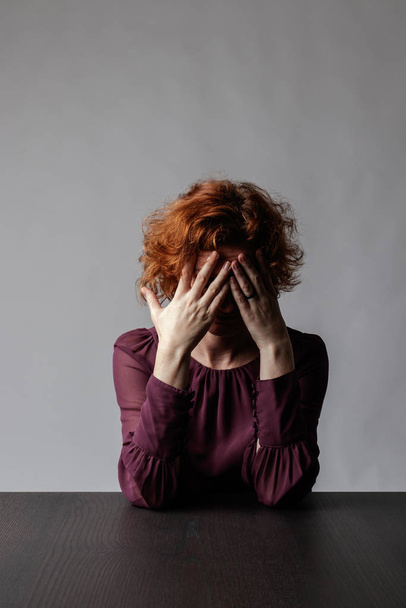 Sad red-haired woman. Depression.  - Photo, Image