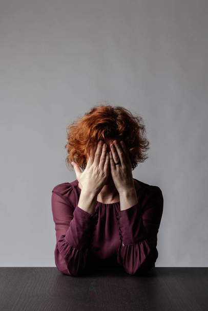 Sad red-haired woman. Depression.  - Photo, Image
