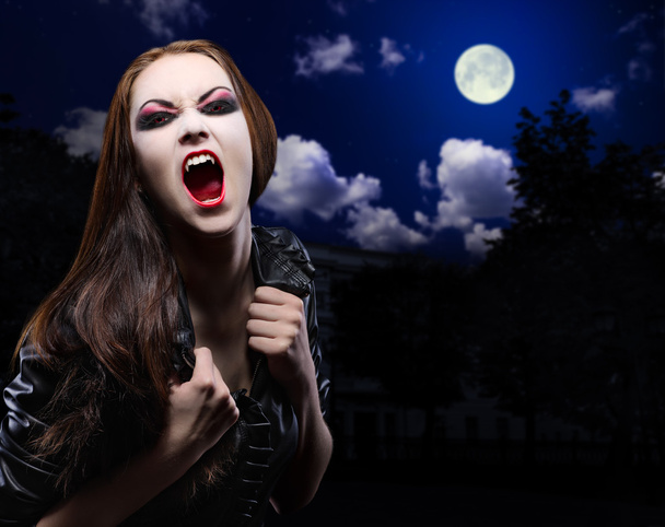 Vampire girl on night sky - Фото, зображення