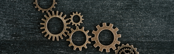 top view of retro metal gears on dark wooden background, panoramic shot - Φωτογραφία, εικόνα