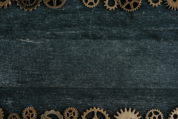 borders of vintage metal gears on dark wooden background with copy space - Φωτογραφία, εικόνα