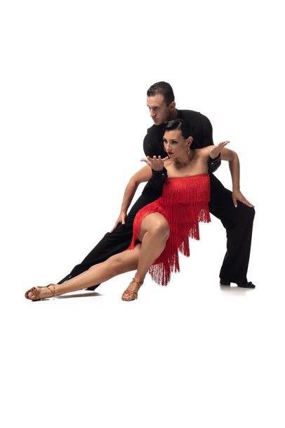 passionate, elegant couple of dancers performing tango on white background - Zdjęcie, obraz