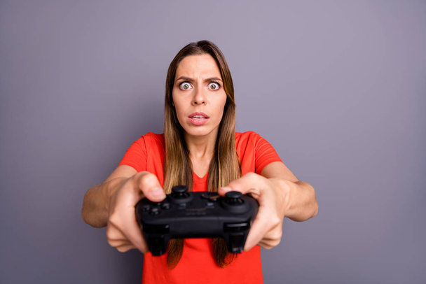 Portrait of impressed worried girl play video game dont want lose feel focused wear good looking clothing isolated over grey color background - Fotoğraf, Görsel