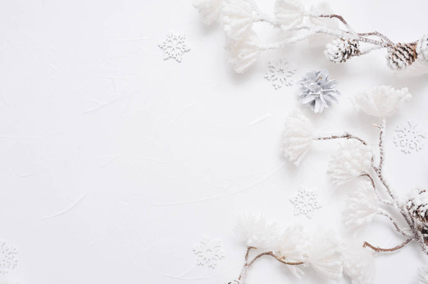 White Christmas border with cones, snowflakes and snown flowers. Xmas Wreath decoration with place for your text - Photo, image