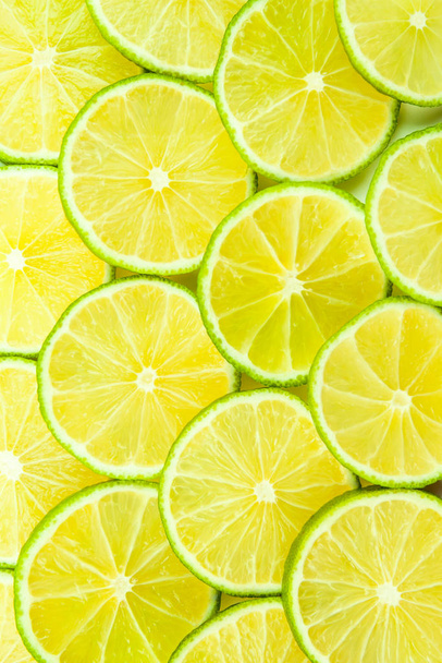 Juicy limes sliced and arranged in rows - Photo, Image