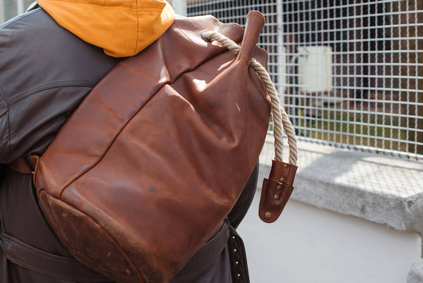 Man travel with leather backpack, close up. Urban style, street fashion. Fashion man with luggage, back view - Fotoğraf, Görsel