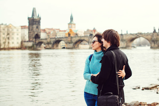 Honeymoon travels in Europe. Young couple enjoying great view on Prague city. Love, honeymoon, lifestyle. Travelling in Europe - Photo, Image
