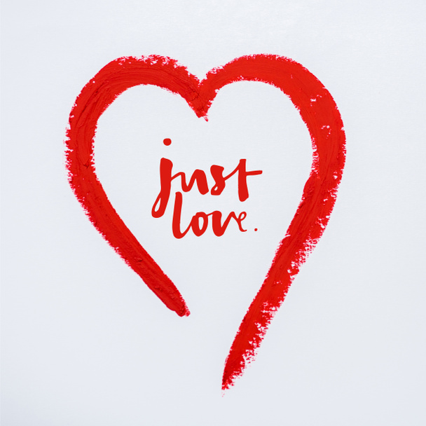 red drawn heart near just love letters on white  - Фото, изображение