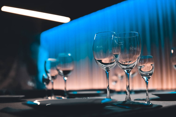 table setting with shiny wineglasses in restaurant - Foto, Imagen
