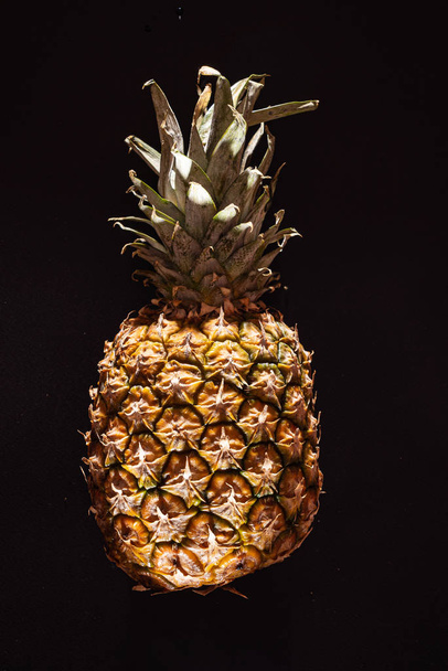 pineapple on the black background - Fotoğraf, Görsel