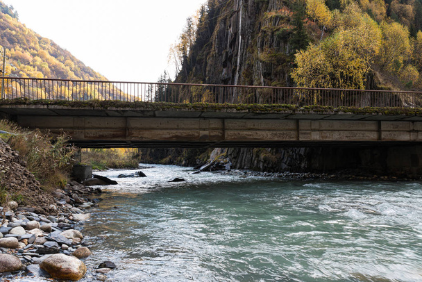 Transport bridge over the bed of a mountain river in Svaneti in the mountainous part of Georgia - Photo, Image