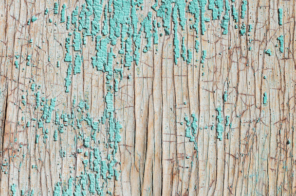 Old and peeling paint Over time, the green paint peeled off from the old boards and the wood texture cracked. Vintage Abstract Grunge Background - Fotoğraf, Görsel