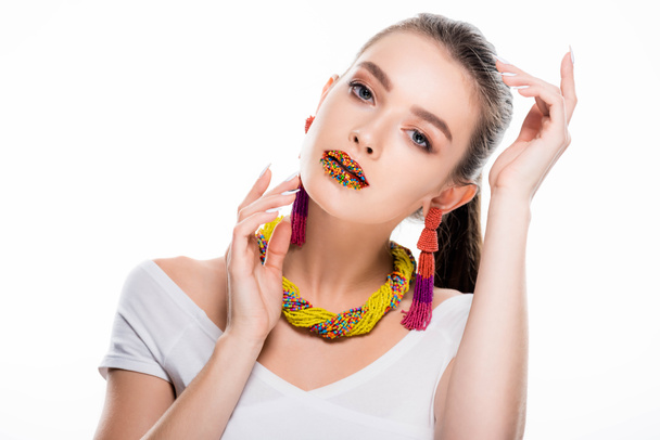 beautiful girl in beaded accessories, with beads on lips, looking at camera isolated on white - Fotó, kép