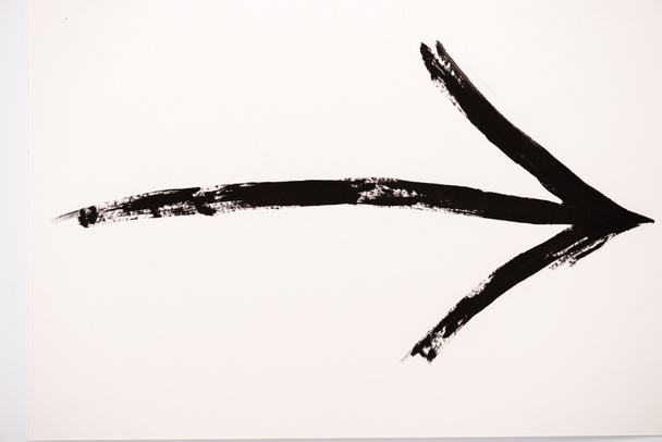 black directional arrow on white with copy space  - Fotó, kép