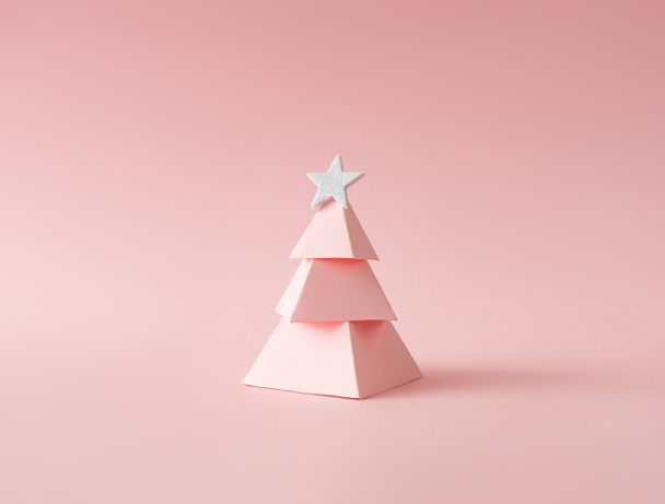 toy pink Christmas tree on pastel background. Happy holidays and new year minimal concept. - Photo, Image