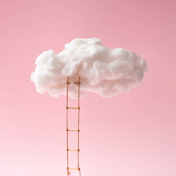 composition of step ladder leading to clouds on pink background, future and development concept - Photo, Image