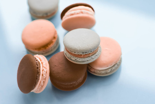 French macaroons on blue background, parisian chic cafe dessert, - Foto, immagini