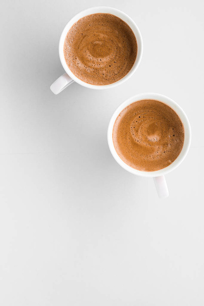 Cup of hot french coffee as breakfast drink, flatlay cups on whi - Fotó, kép