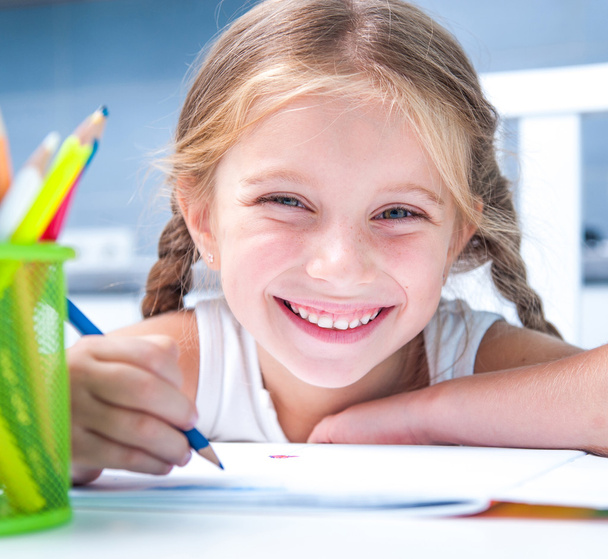 little girl drawing with pencils - Fotó, kép
