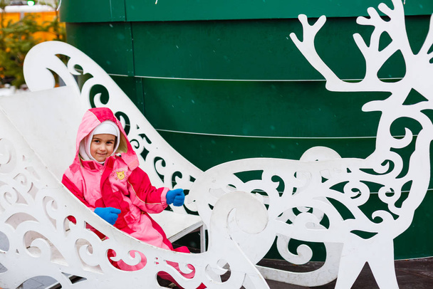 girl at Sofievskaya square during holding Christmas market  - Photo, Image