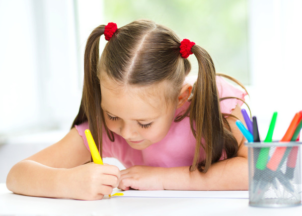 Cute cheerful child drawing using felt-tip pen - Фото, изображение
