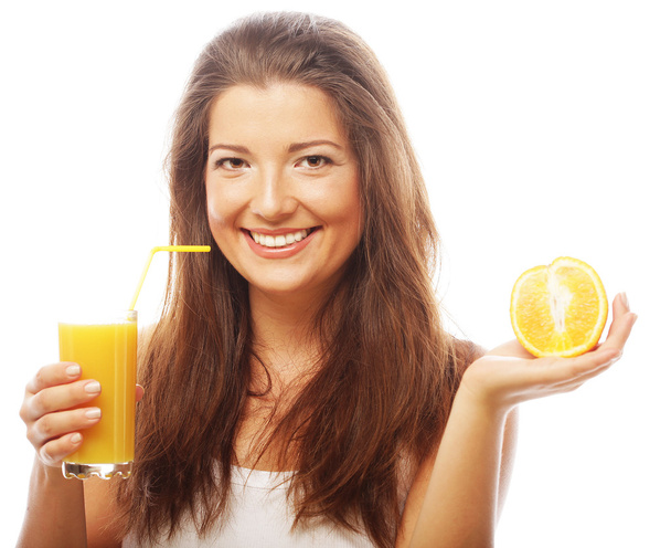 Woman holding orange juice - Foto, imagen