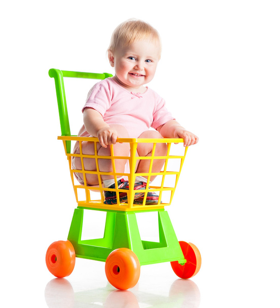 baby in a supermarket trolley - Fotó, kép