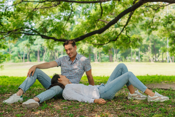two caucasian lover couple having romance moment in park togethe - Фото, изображение