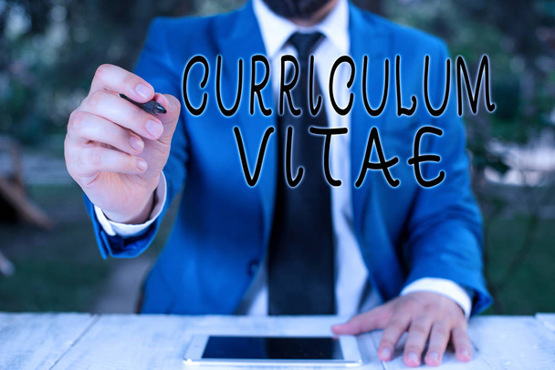 Conceptual hand writing showing Curriculum Vitae. Business photo text a brief account of a demonstrating s is education and qualifications Businessman holds pen and points into copy space. - Photo, Image