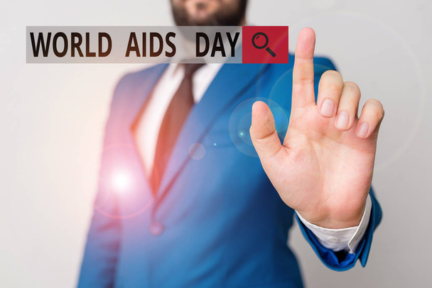 Tekstimerkki, jossa näkyy maailman aids-päivä. Käsitteellinen valokuva 1. joulukuuta omistettu tietoisuuden lisäämiseen AIDS-liikemiehestä osoittamalla sormella hänen edessään
. - Valokuva, kuva