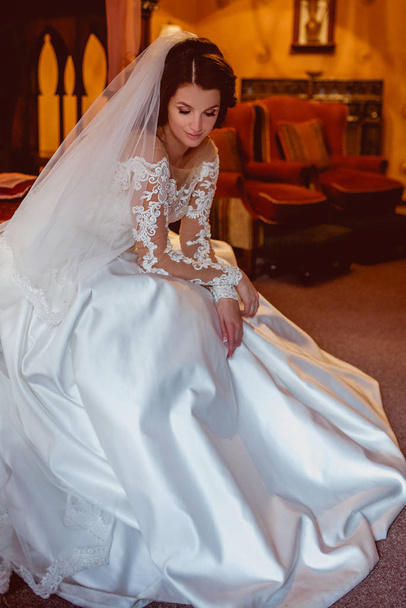 portrait of caucasian beautiful attractive brunette woman bride in traditional european white dress in wedding day - Zdjęcie, obraz