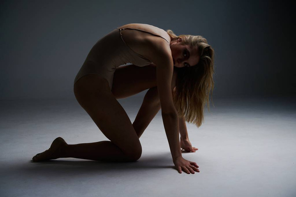 gorgeous female athletic woman in bodysuit  - Valokuva, kuva