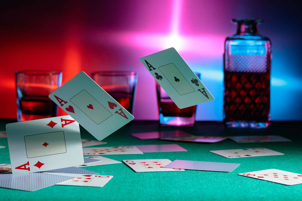 Cards fall on a casino table . Concept of gambling. - Photo, Image