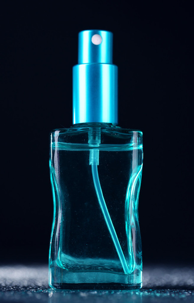 Women perfume in beautiful bottle on dark background - Fotó, kép