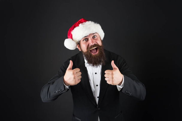 Cheerful mood. Happiness and joy. Corporate christmas party. Man bearded hipster wear santa hat. Christmas spirit concept. Manager celebrate new year. Christmas party. Corporate holiday ideas - Valokuva, kuva