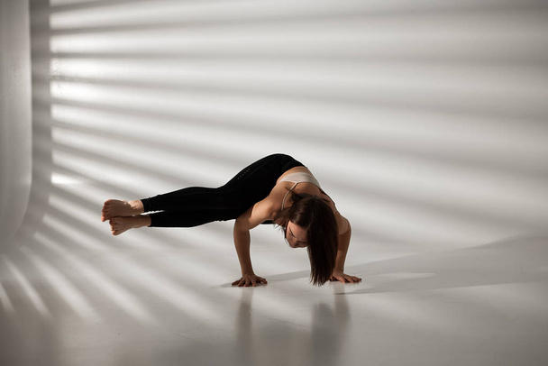 Young girl doing yoga, girl doing yoga exercises - Foto, afbeelding