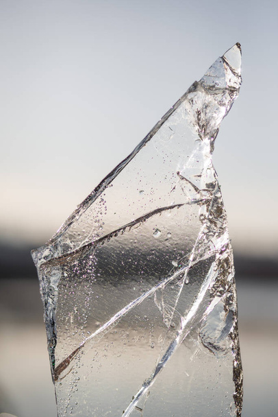 Transparent shards for glow and Shine in the sun. The first frost, cracked ice - Photo, Image