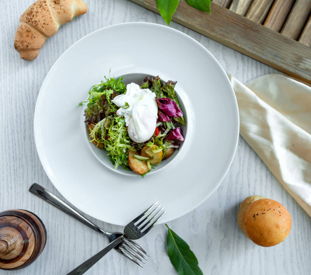 green salad with potatos on the white plate - Φωτογραφία, εικόνα
